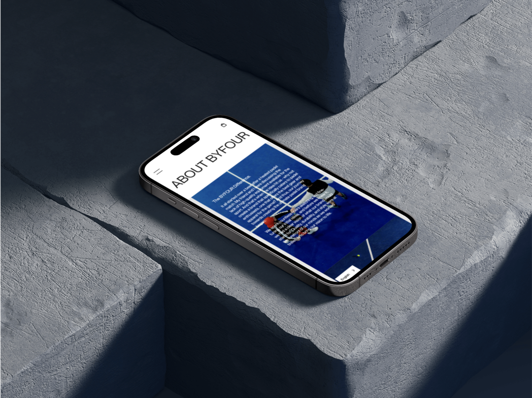 Iphone mockup showing the By Four About page developed by Can O' Baked Beans.